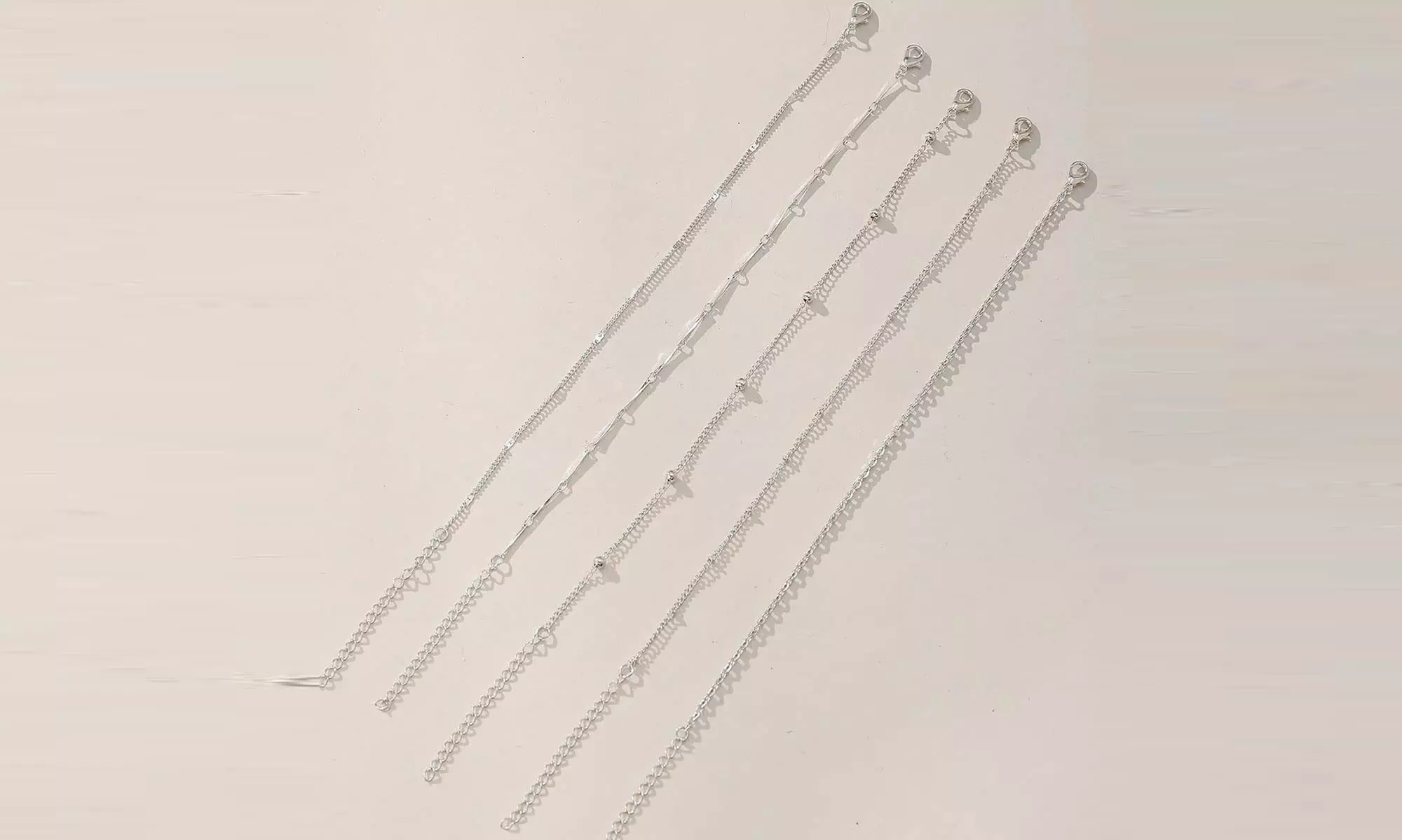 1 of 2 sets van 5 verstelbare enkelbandjes