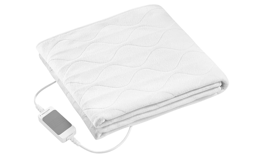 Image 7: Restez au chaud avec un coussin ou une couverture chauffante