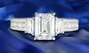 Tri Stone Emerald Cut Engagement Ring in 18k White Gold