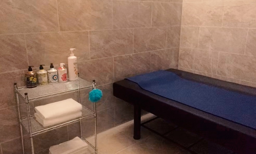 Image 5: Deep Tissue Hot Stone Massage with Walk-On-Back for One or Couples