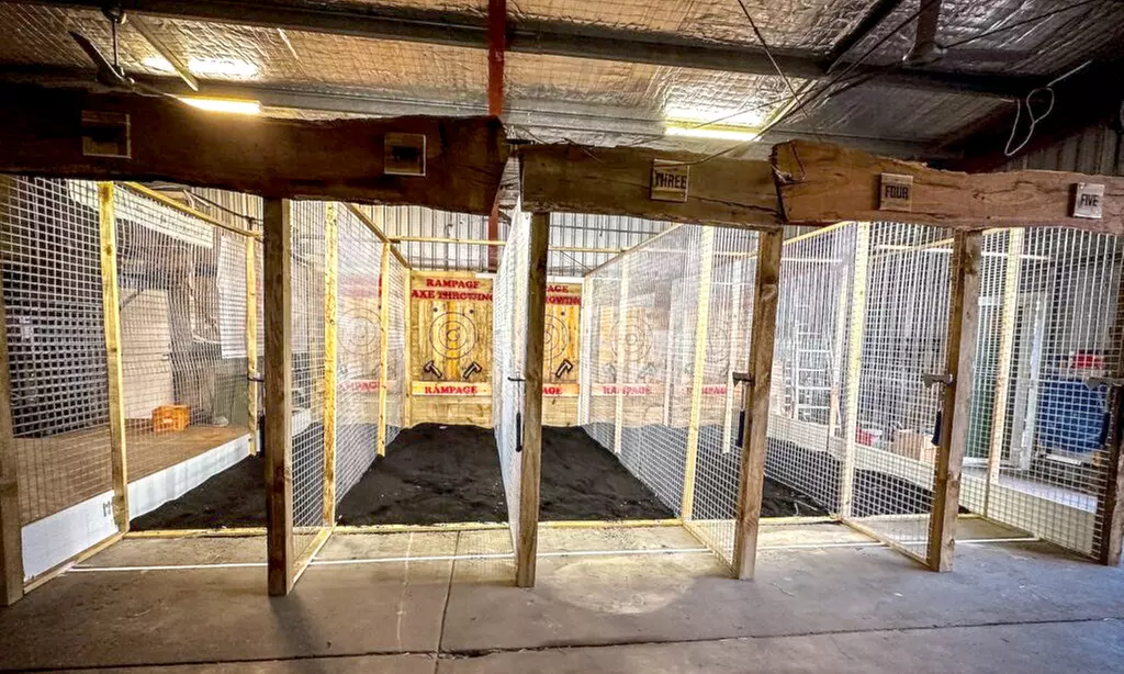 Unleash Your Inner Warrior: Axe Throwing – Book Your Rampage Session!