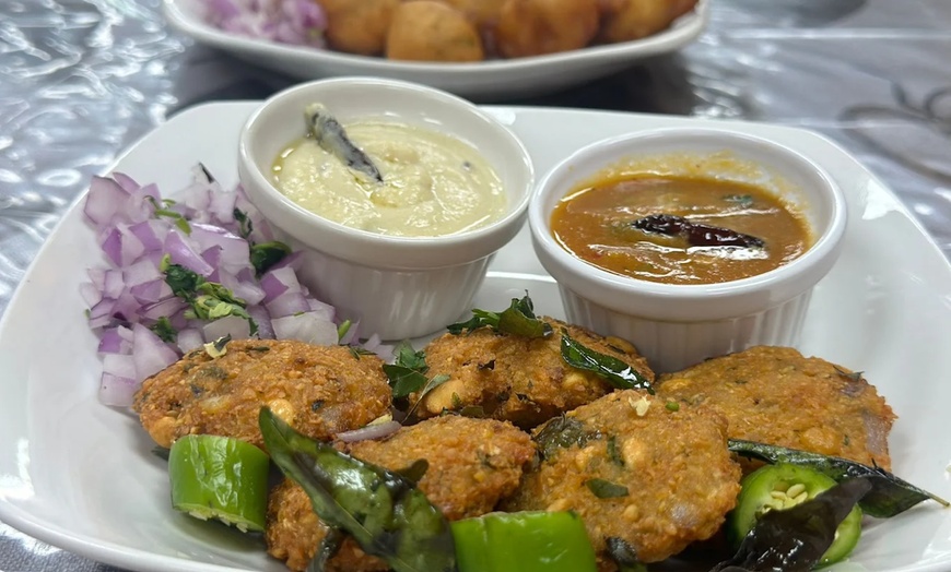 Image 5: Any Entree with a Side of Naan,  $25 or $50 Towards Food and Drinks