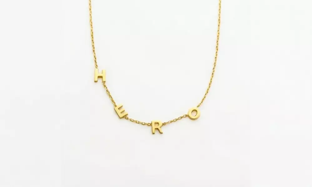 Design a unique 14K solid gold initial necklace with Becca Prado, featuring customizable options from 1 to 8 letters
