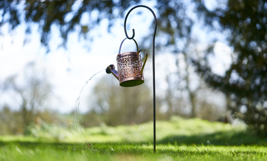 Image 8: Solar-Powered Illuminated Metal Watering Can Ornament