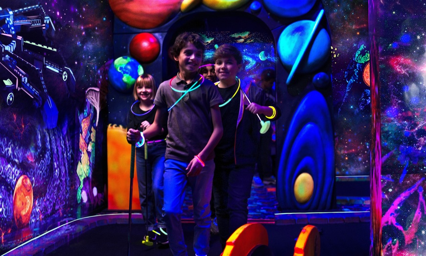 Image 1: Blacklight Space-Themed Mini Golf Adventure