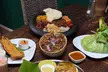Delicious Indian starter, our main Koottaan Signature main course, and wine for 2 at Koottaan (Up To 44% Off) - Second Medium
