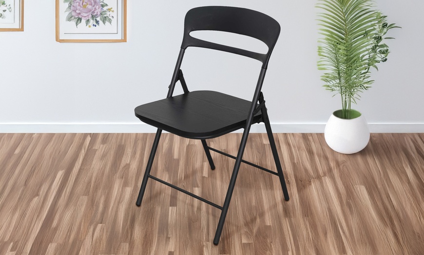 Image 10: Juego de 4 sillas plegables de metal con asiento de madera