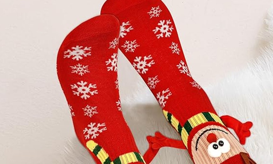 Image 2: Pack of Four Magnetic Hand-Holding 3D Christmas Socks