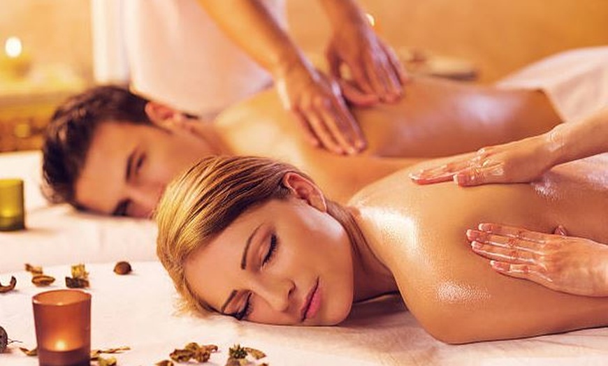 Image 1: One 60 or 90-Minute Couples Massage with Hot Stone and Aromatherapy