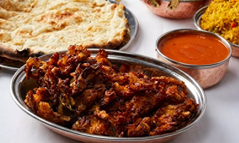 Three Course Indian Meal with Bottle of Wine for Two or Four People