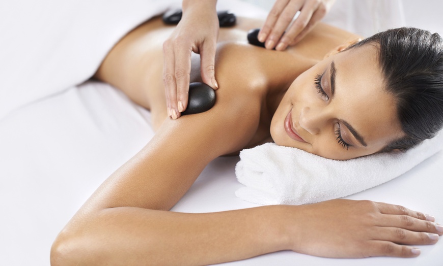 Image 1: Relax & Rejuvenate w/ 60, 75, or 90-Minute Swedish Massage & Hot Stone