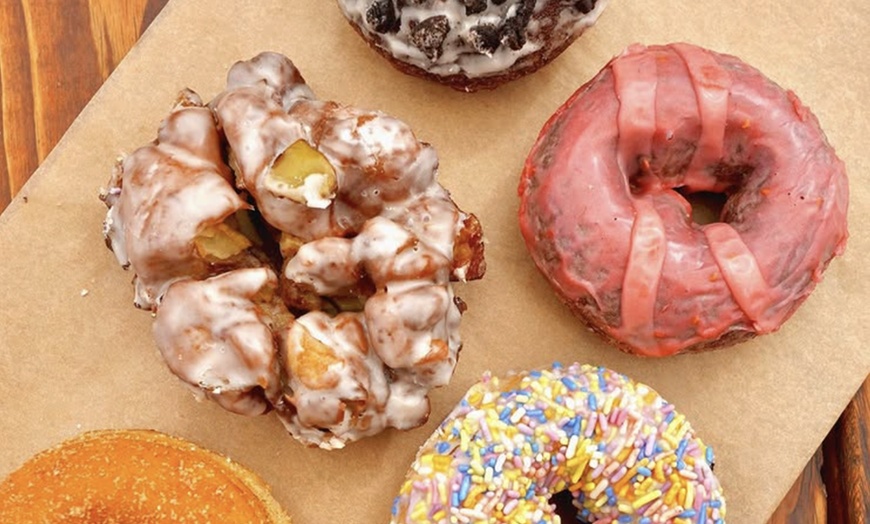 Image 25: Up to a Dozen Donuts, 4 Donuts & 2 Drinks or $50 to Spend