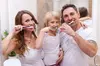 Comprehensive or Emergency Exam and X-Rays or Deep Cleaning with Antimicrobial Gum Irrigation (Up to 86% Off)