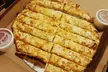 Pizza Lovers’ Special: $10 Credit, 12” Cheese Pizza & Soda, or 16” 1-Topping Pizza & Drinks! (Up to 37% Off) - Second Medium