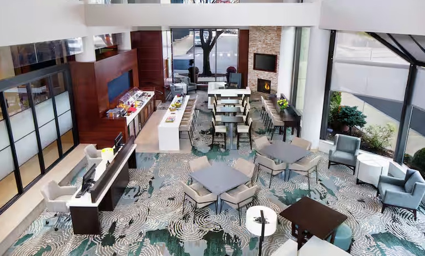 Image 15: Modern 4-Star Stay w/ Pool, Dining, & SNHU Arena Convenience