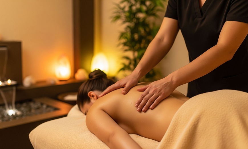 Image 1: 60-Min Swedish Massage with Aromatherapy and Hot Stones for One or Two