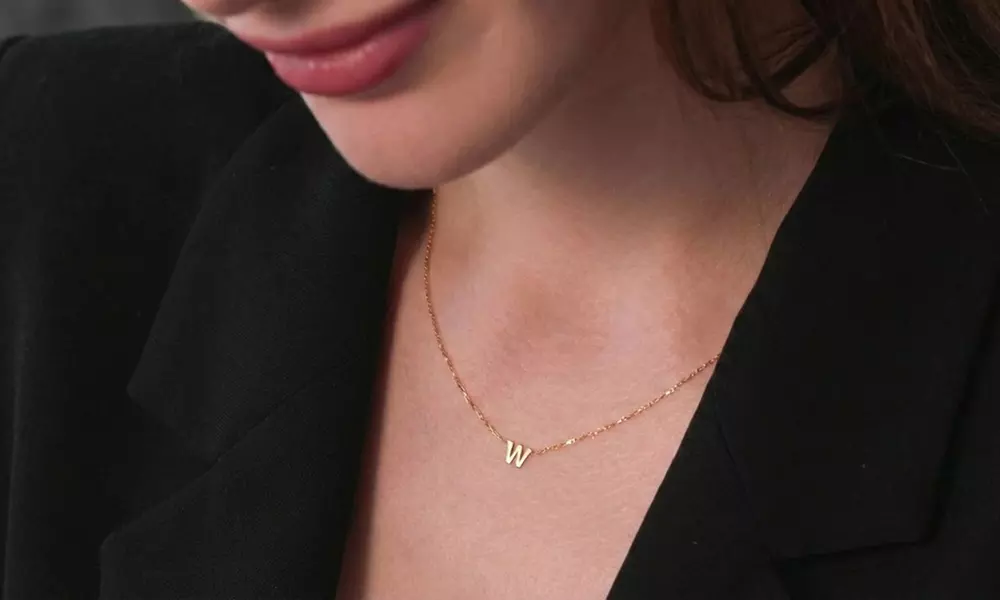 Design a unique 14K solid gold initial necklace with Becca Prado, featuring customizable options from 1 to 8 letters