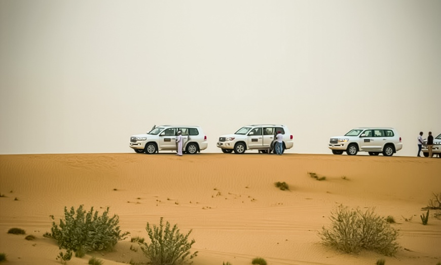 Image 2: Evening Desert Safari + BBQ, Sandboarding & Camel Ride For Up to 6