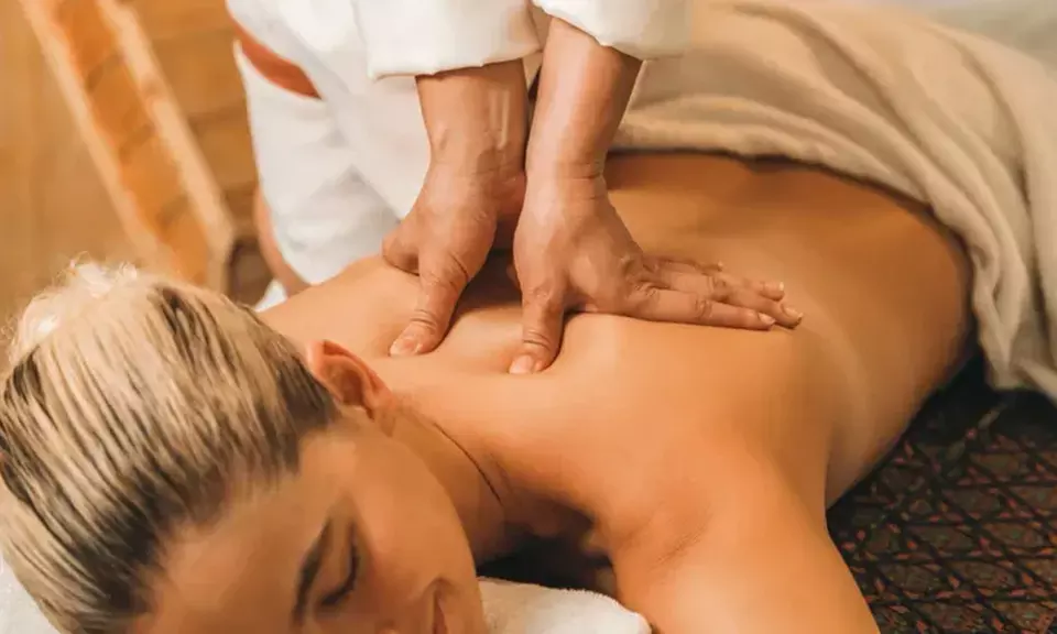 Deep Tissue, Signature Combo, Relaxing Body Massage with Optional Hot Stone and More at Yumi Spa (Up to 50% Off) - Primary Image