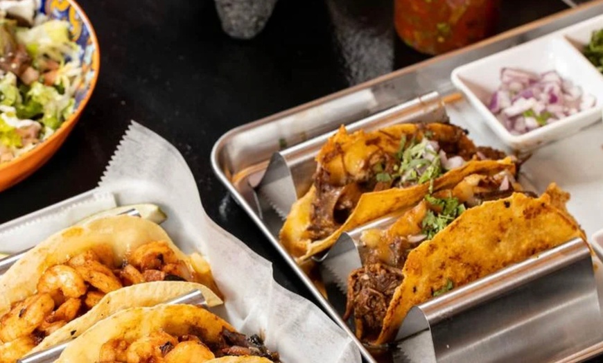 Image 19: Vibrant Rooftop Dining: Choose Meals, Margaritas, or Dining Credit