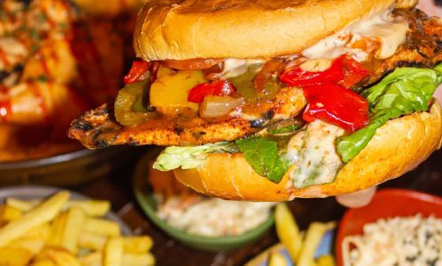 Image 4: Main Course with Glass of Wine, Beer, or Soft Drink at Saint Jude’s 