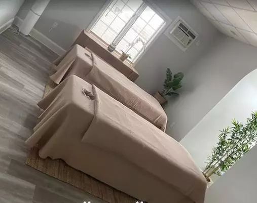 60-Minute Therapeutic Massage or Couples Massage with Hot Stones