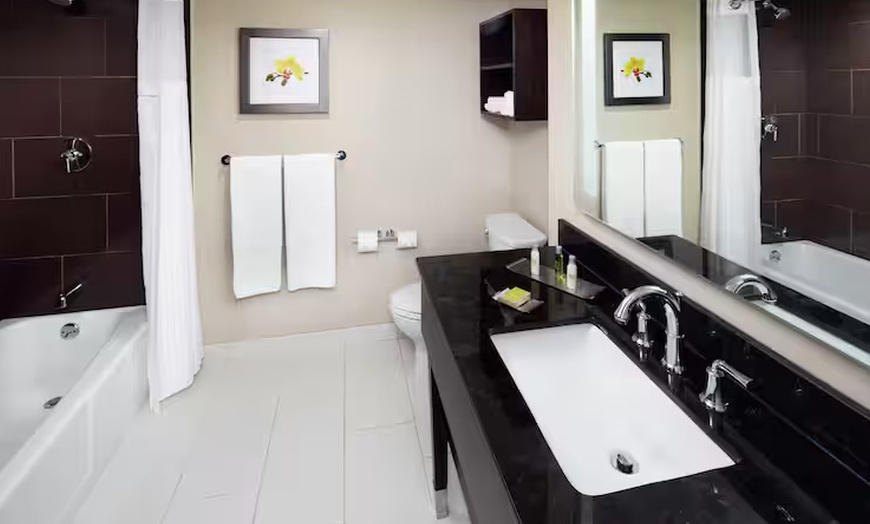 Image 10: Modern 4-Star Stay w/ Pool, Dining, & SNHU Arena Convenience