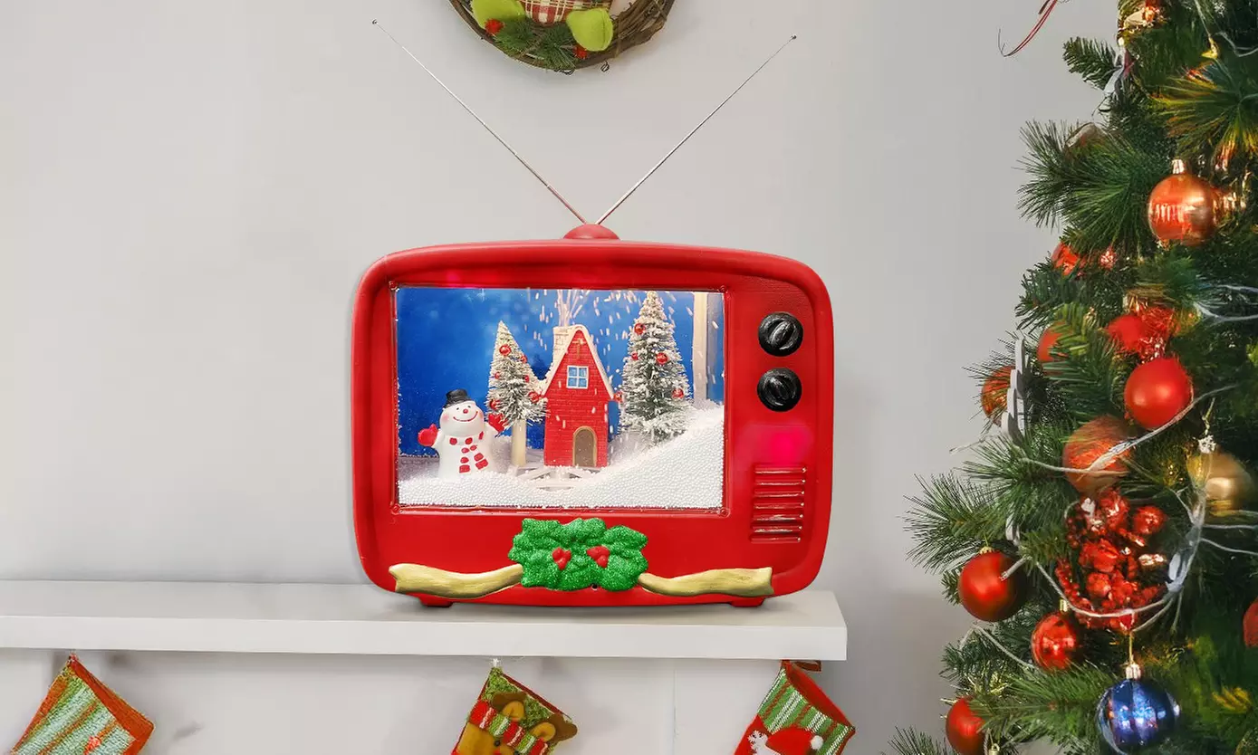 Decoración navideña con forma de televisión, con luces, música y paisaje en movimiento - Primary Image