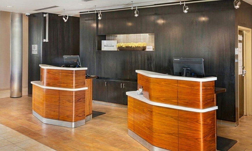 Image 11: Courtyard-Style Hotel Retreat with Outdoor Pool & Bistro Dining