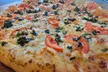 Crave-Worthy Combos - Choice of Appetizers, Large Salad, 14'' or 16'' Specialty Pizza, & More (Up To 36% Off) - Second Medium