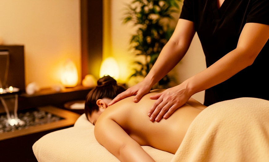 Image 1: Swedish or Deep Tissue Massage with Hot Stones & Aromatherapy