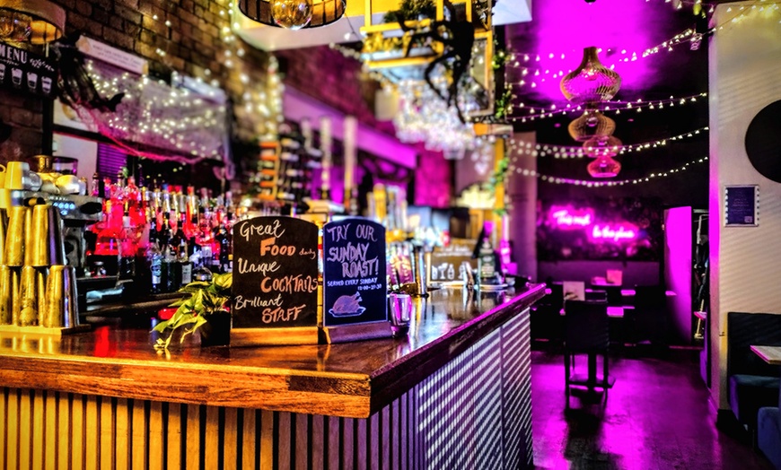 Image 3: Bottomless wings feast with a lively bar vibe