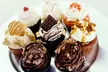 Delight In A Dozen Cupcakes, Cake Pops, Or A Sweet Cupcake Or Cookie Bouquet Up to 29% Off at Tamu Cupcakery - Second Medium