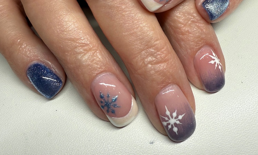 Image 1: Revitalize with a Basic Pedicure or Gel Polish Manicure