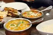 $25 or $50 Toward Food and Drink Or Dinner with Drink for Two or Four People at The Spice Garden (Up to 30% Off) - Second Medium