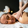 Image 1: Unwind with One 60 or 90 Minute Hot Stone or Coconut Oil Massage 