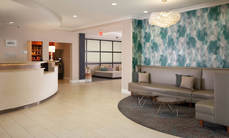 Image 2: Spacious suites, free breakfast, pool, and easy access to beaches