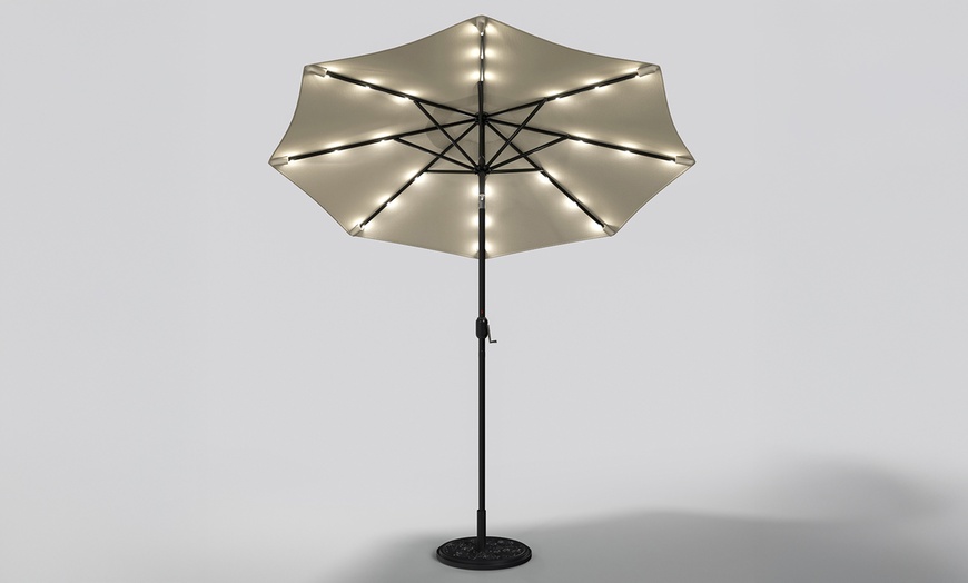 Image 6: Rotatable Solar Lighting Garden Umbrella with Fillable Base