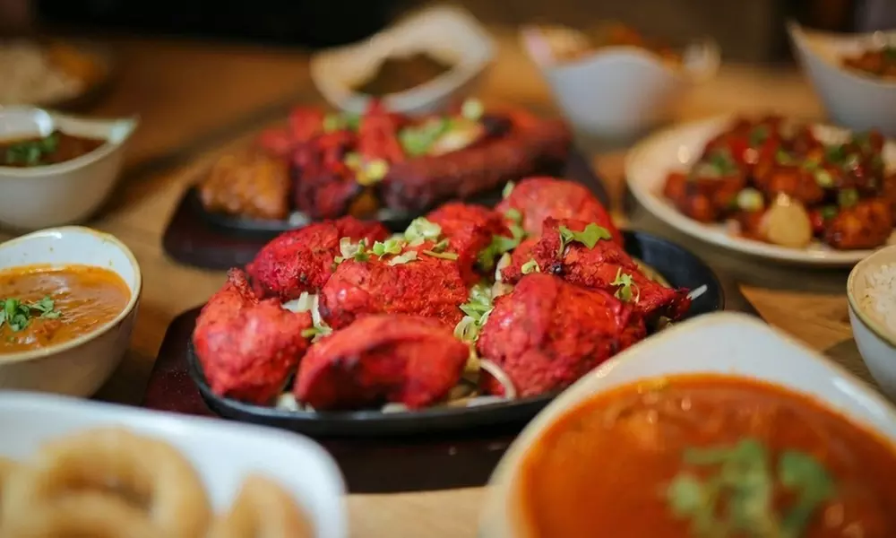 Indulge in a 2-course Indian meal with rice and naan for one to Four at The Swansea Jack - Second Medium