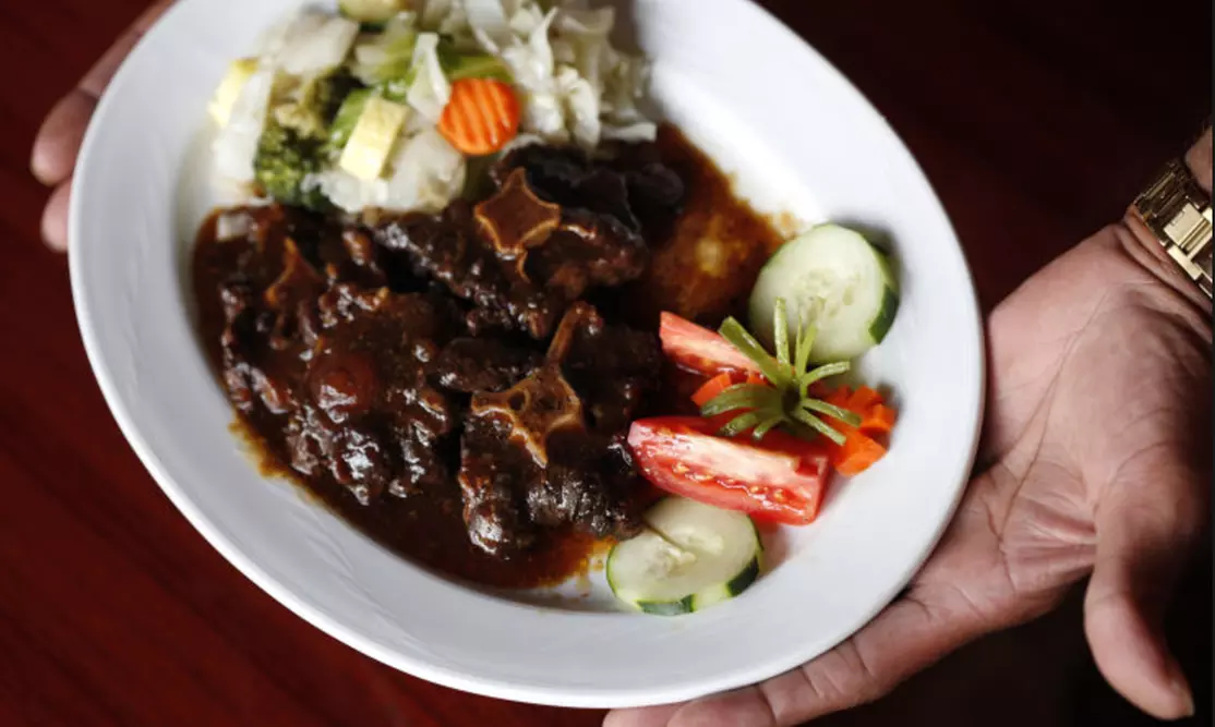 $20 Worth of Caribbean Cuisine or Dinner for Two at Taste of the Islands (Up to 50% Off) - Primary Image