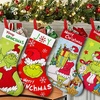 Image 2: 4-Pack Grinch-Inspired Christmas Stockings 