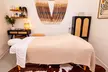 Soothing Serenity Awaits with 60-Minute Restorative Massage with Hot Stones at Rewind Skin ( Up to 30% Off ) - Second Medium