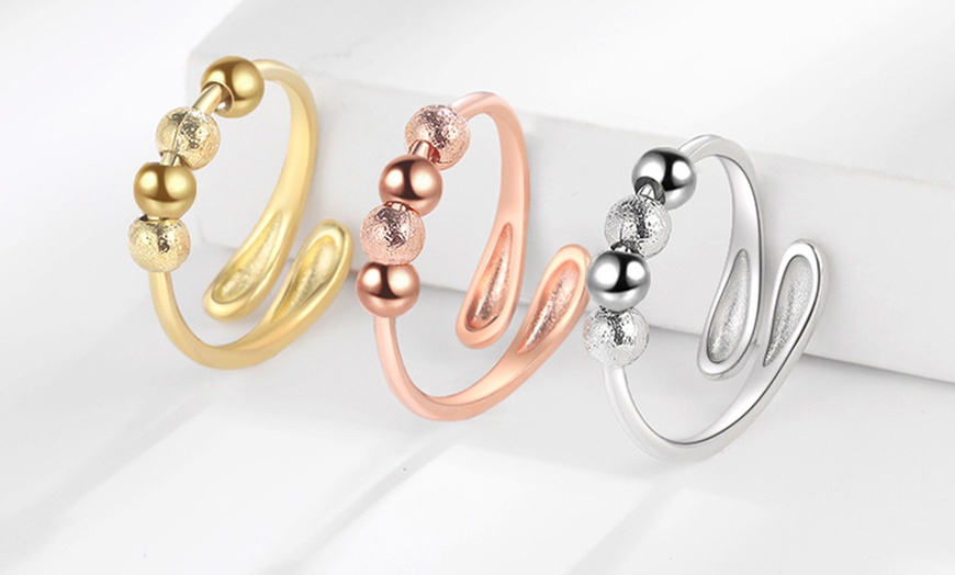 Image 1: Stress-Relieving Spinner Rings with Adjustable Designs