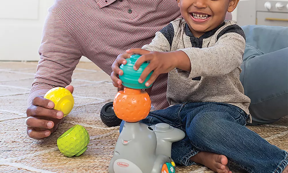 Foca Stack & Spin Infantino con 4 sfere sensoriali impilabili ed effetti sonori musicali - Primary Image