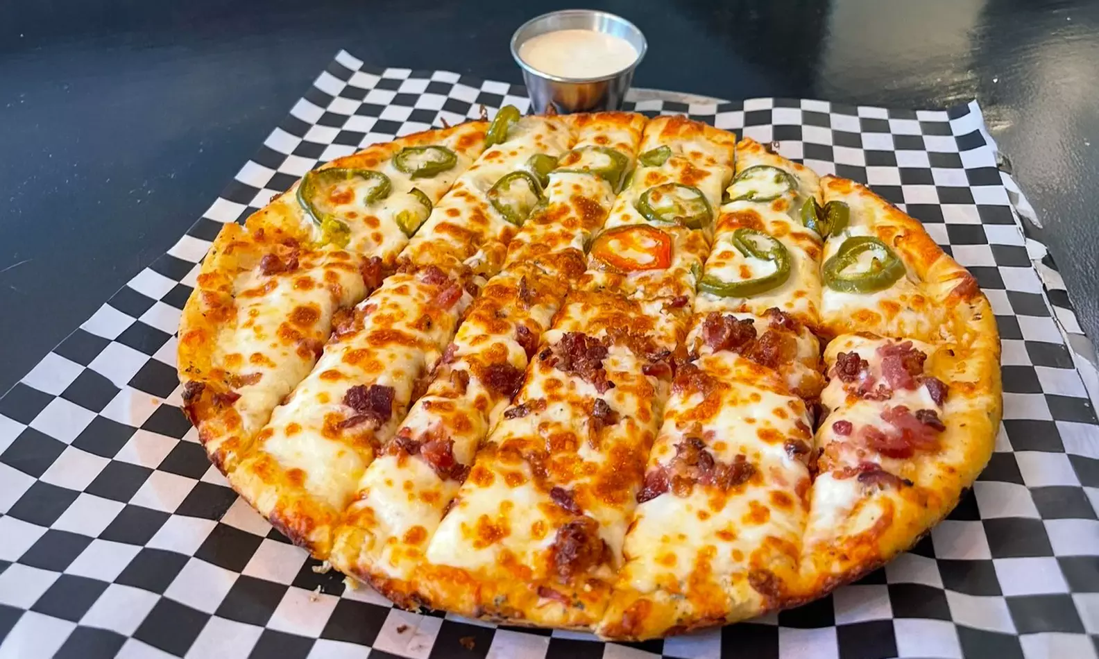 Enjoy Artisan Pizza, Specialty Sandwiches, Salads, Wings & Great Beers