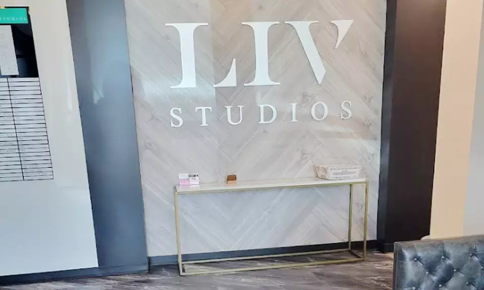 Haircut with Condition, Blow-Dry & Optional Root Touchup or Highlights