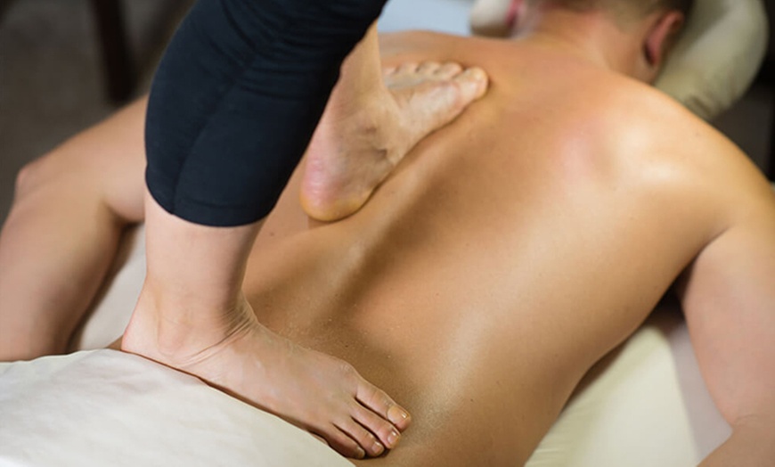 Image 1: Unwind with 50-Minute Back Walk/Ashiatsu Massage Session