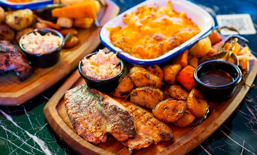 Image 1: Up to 50% Off on African Cuisine at Banana Island Lounge