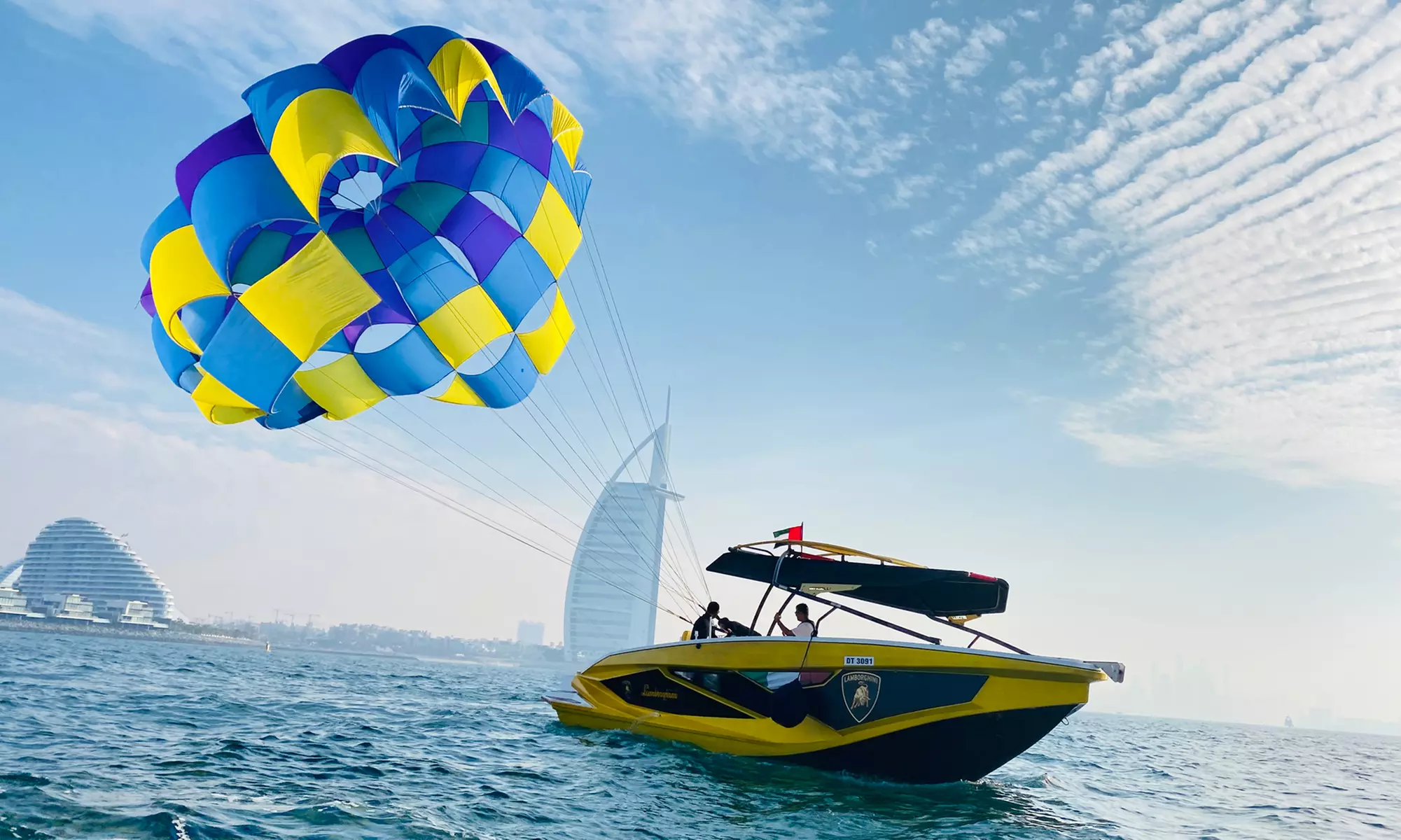 Soar Above Dubai's Coastline with 30-Minute Parasailing for One or Two