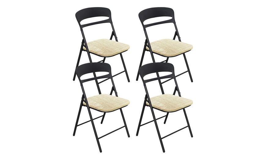 Image 5: Juego de 4 sillas plegables de metal con asiento de madera